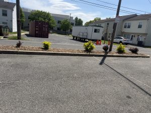 Commercial rock landscape bed with new shrubs by Justin's Lawn Service
